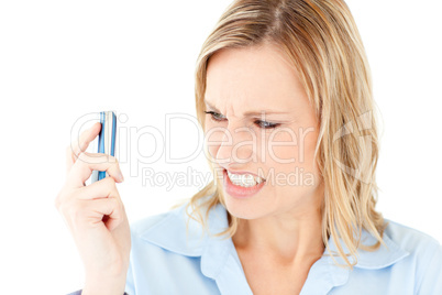 Furious businesswoman looking at her cellphone