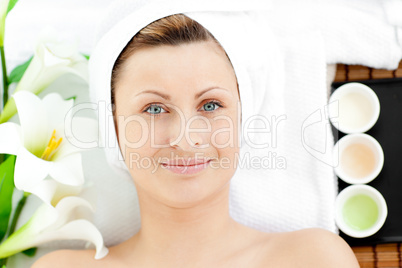 Charming young woman woman lying on a massage table