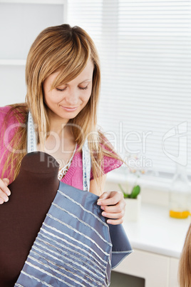 Woman sewing at home