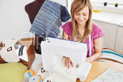 Bright woman sewing at home