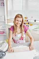 Portrait of a beautiful woman baking in the kitchen