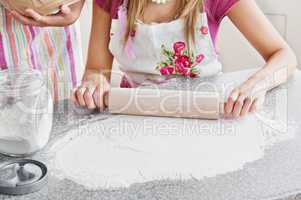 Close-up of two caucasian woman baking in the kitchen