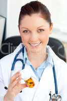 Glowing young female doctor looking at pills