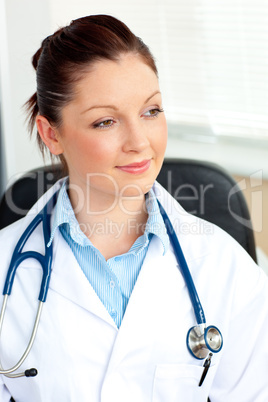 Confident female doctor sitting in her office