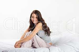 lachende Frau im Bett