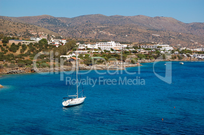 Yacht at the beach of luxury hotel, Crete, Greece