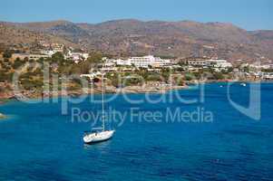 Yacht at the beach of luxury hotel, Crete, Greece