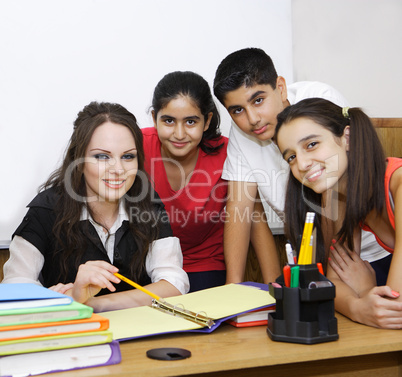 Teacher and students posing