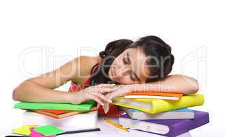 Tired student sleeping on books