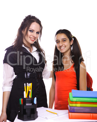 Teacher and Student standing in front of desk