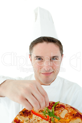 Sophisticated male cook holding a pizza