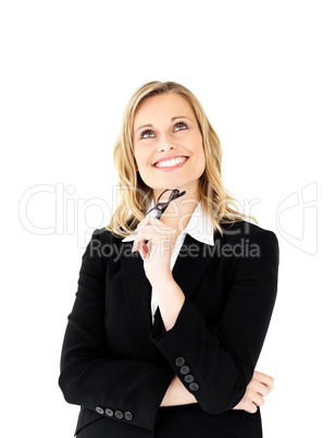 Confident businesswoman holding glasses smiling at the camera