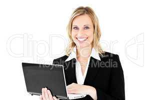 Delighted businesswoman using her laptop standing