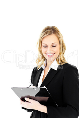 Positive businesswoman holding a clipboard standing