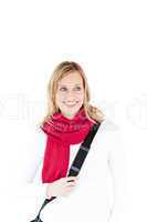 Happy woman wearing red scarf smiling at the camera