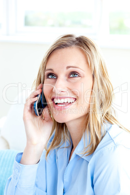Delighted businesswoman talking on phone