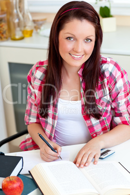 Radiant student doing her homework at home