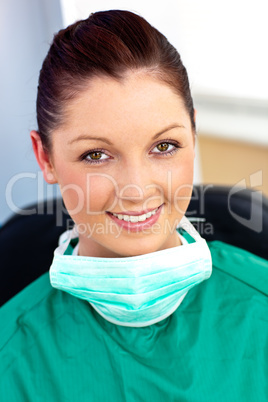 Assertive female doctor with scrubs sitting in her office