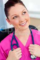 Pensive female surgeon with a stethoscope