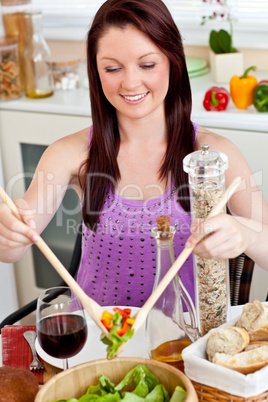Positive woman eating her healthy meal at home
