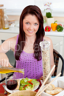 Bright woman eating her healthy meal at home