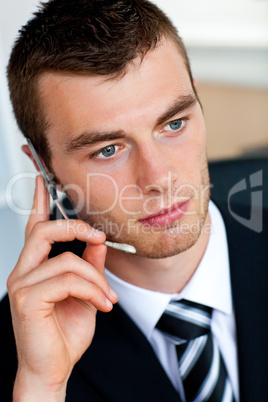 Serious businessman wearing headset