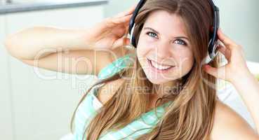 Smiling young woman listen to music