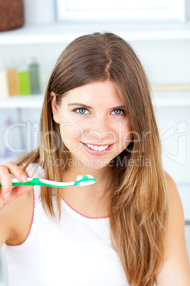 Captivating caucasian woman holding a toothbrush