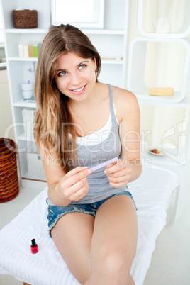 Attractive young woman file her nails in the bathroom