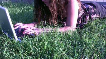 Girl outdoors with laptop