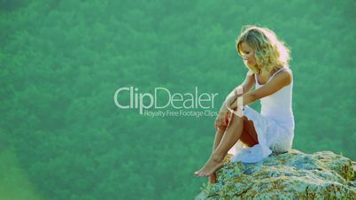 Girl on the edge of the cliff
