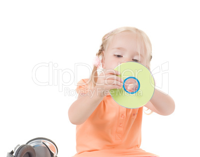 Shot of little girl with CD in studio