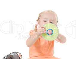 Shot of little girl with CD in studio