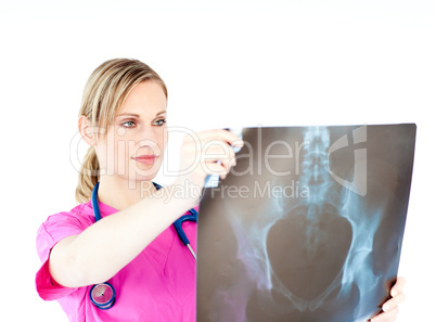 Serious female surgeon holding a x-ray
