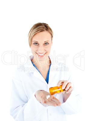 Portrait of a caucasian doctor holding pills