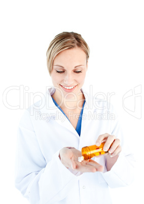 Close-up of a caucasian doctor holding pills