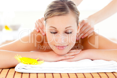 Portrait of a delighted woman lying on a massage table
