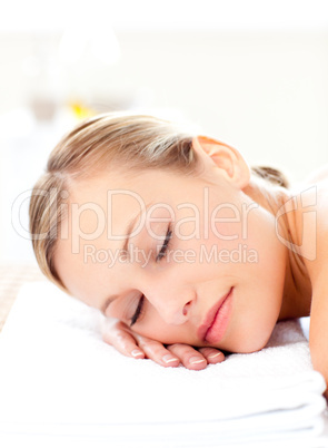 Close-up of a radiant woman lying on a massage table