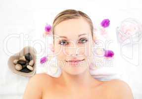Close-up of a cute caucasian woman lying on a massage table