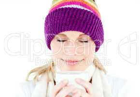 Delighted woman wearing a white pullover and a colorful hat