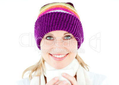 Glowing woman wearing a white pullover and a colorful hat