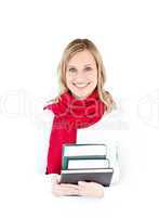 Portrait of a beautful woman with a red scarf holding books and