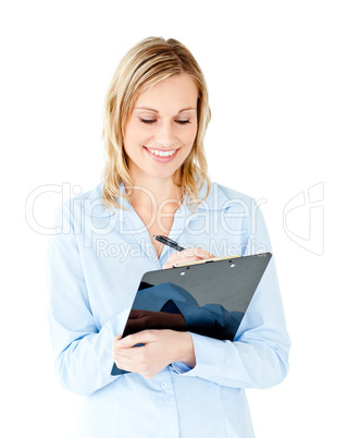 Self-confident businesswoman taking notes on a clipboard