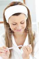 Attractive woman filling her nails in the bathroom