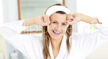 Portrait of a blond woman waking up in her bathroom