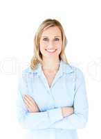 Self-assured businesswoman with folded arms smiling at the camer