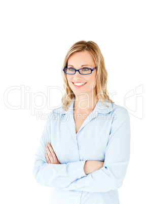 Confident businesswoman with folded arms smiling at the camera