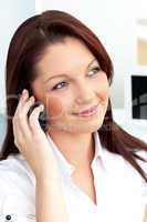 Positive businesswoman talking on phone sitting