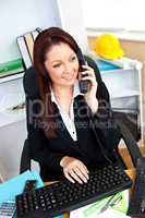 Portrait of a busy businesswoman talking on phone