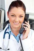 Smiling female doctor talking on phone